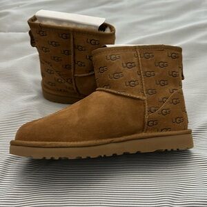 Authentic UGG Women’s Classic Mini Embossed Logo Boots.